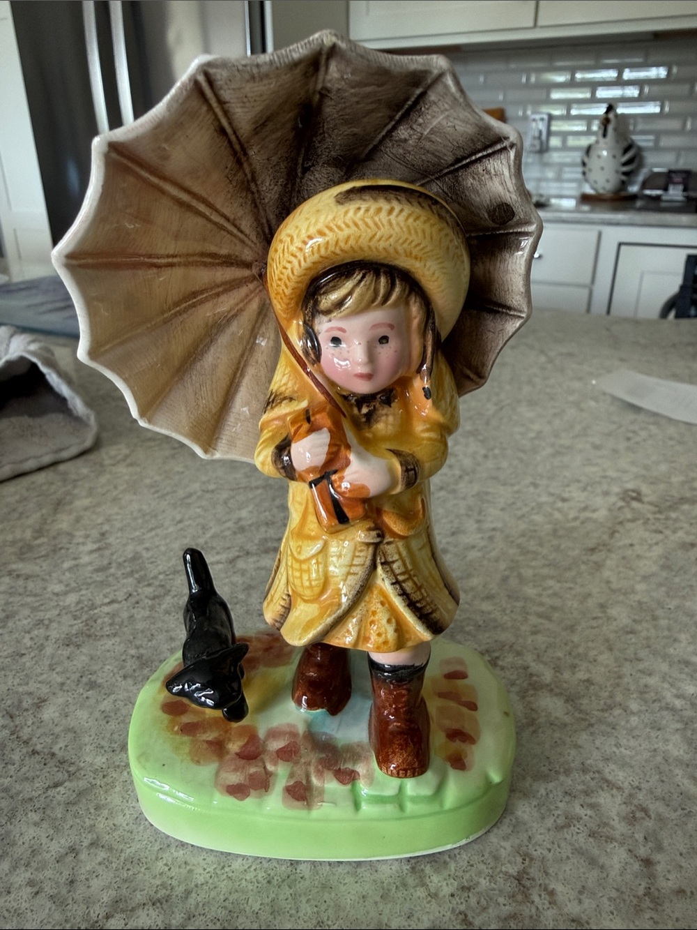 American Greetings Corp yellow raincoat girl with black dog and umbrella.